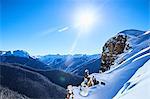 Sunlit landscape of snow covered mountains, Aspen, Colorado, USA