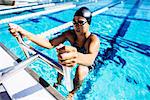 Swimmer in water at end of pool