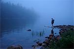 Male hiker by misty river, Acadia, Maine, USA