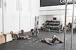 Friends taking break in cross training gym