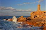 Rocky Coastline and Ploumanach Lighthouse in Ploumanac'h, Pink Granite Coast along the Atlantic Ocean in the Cotes d´Armor in Brittany, France