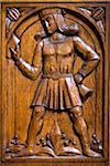 Close-up of an historical wooden carving of government official on a door at the Basel Town Hall (Rathaus), Basel, Switzerland