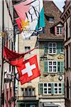 Close-up of traditional buildings and Swiss Flag in historic city of Basel, Switzerland