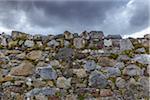 Close-up of a stone wall of an abandoned church with storm clouds on the Isle of Skye in Scotland, United Kingdom