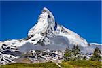 The Matterhorn with grey mountain clouds on a sunny day at Zermatt, Switzerland