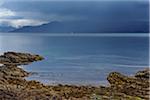 Rainclouds over the Sound of Sleat and Scottish coast near Armadale on the Isle of Skye in Scotland, United Kingdom