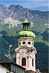 Baroque style 17th Century clock tower of Spitalkirche on Maria Theresien Strasse in Innsbruck, Austria