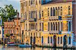 Sunlit historical buildings along the Grand Canal, Venice, Italy