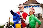 Quirky couple using tower viewer, Bournemouth, England