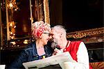 Quirky couple relaxing in bar and restaurant, Bournemouth, England