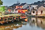 Boats on waterway and traditional buildings, Xitang Zhen, Zhejiang, China