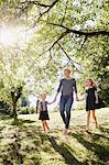 Mother and daughters enjoying park