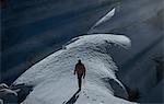 Mountain climber on snow covered mountain, Montblanc, Languedoc-Roussillon, France, Europe