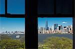 Silhouetted window frame view of Manhattan cityscape and skyline, Times Square, New York, USA