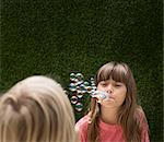 Girl blowing bubbles