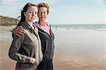 Mother and daughter on beach, Folkestone, UK