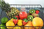 Fruits and juice in wire basket