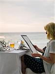 Woman reading menu in restaurant