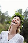 Happy woman wearing leaf wreath