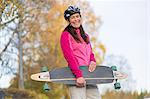 Woman carrying longboard