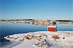 Lake and boat house in winter scenery