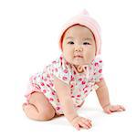 Portrait of full length cute Asian baby girl in pink clothes crawling on floor, isolated on white background.
