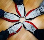 children's feet in shoes and a bowling ball for the game