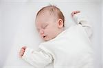 close-up portrait of a beautiful sleeping baby girl on white