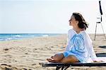 Young relaxed woman at beach