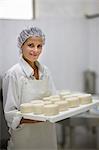 Worker at a cheese dairy