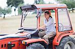 Female farmer driving a tractor
