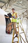 Aircraft worker checking airplane