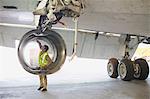 Aircraft worker checking airplane