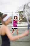 Serious girl playing tennis
