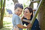 Mother and son playing with ladder