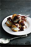 Plate of cream puffs with chocolate