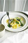 Plate of ravioli and herbs