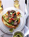 Plate of steak on burger bun