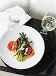 Plate of bread, tomato and asparagus