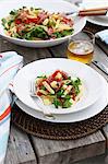 Plate of vegetable pasta on table