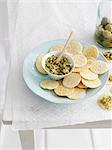 Plate of crackers with topping