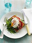 Egg, tomatoes and salad on toast