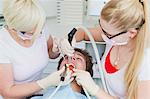 Dentists working on patients teeth