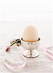 Egg in silver egg cup