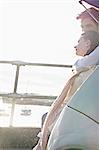 Couple looking out from trunk of car