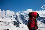 Backpacker admiring snowy mountains