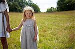 Girl in costume standing in field