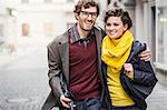 Couple walking together on city street