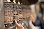 Close up of carved wooden poles