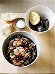 Bowl of mussels with capsicum salad